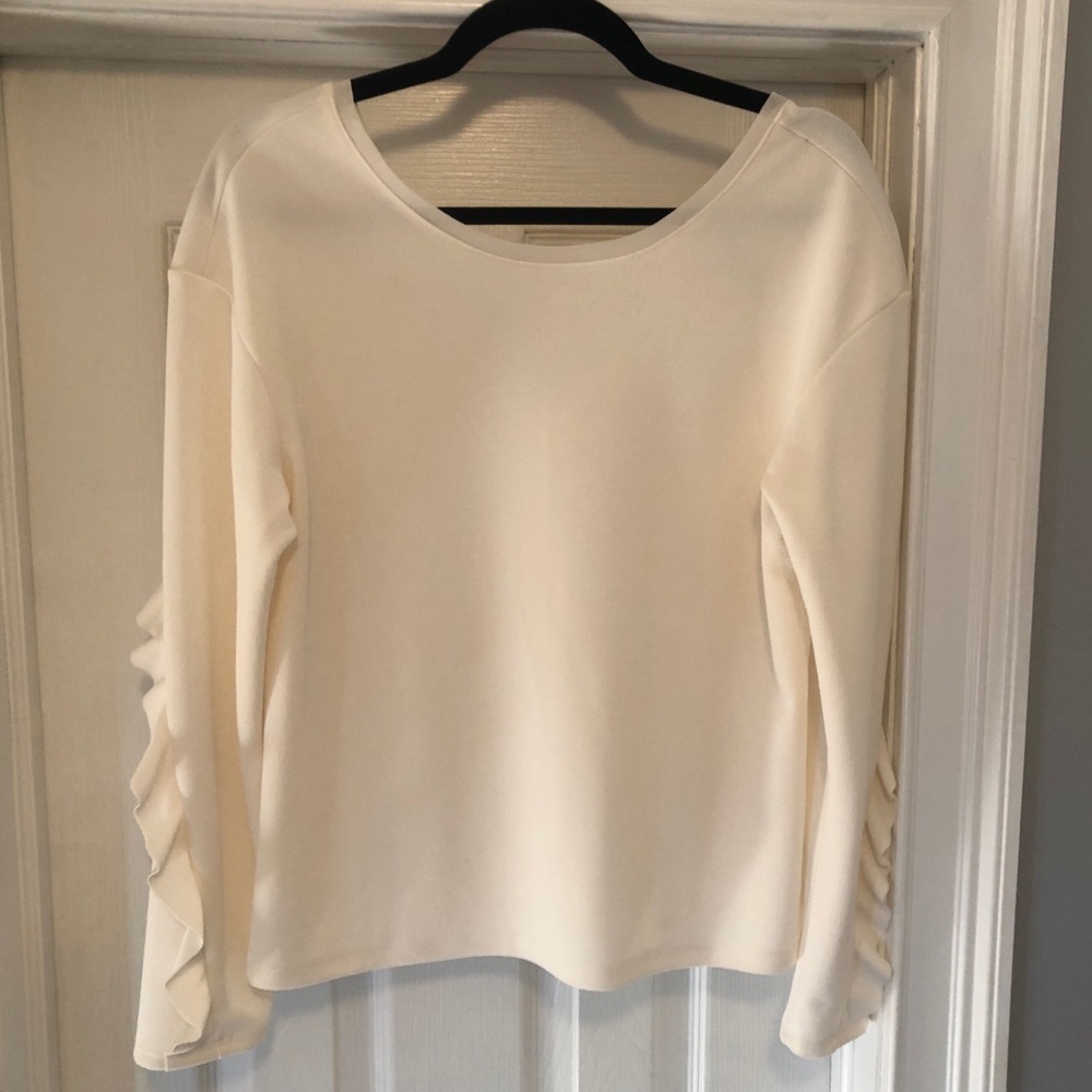 Beautiful white long sleeve ruffled top. Perfect for winter or fall